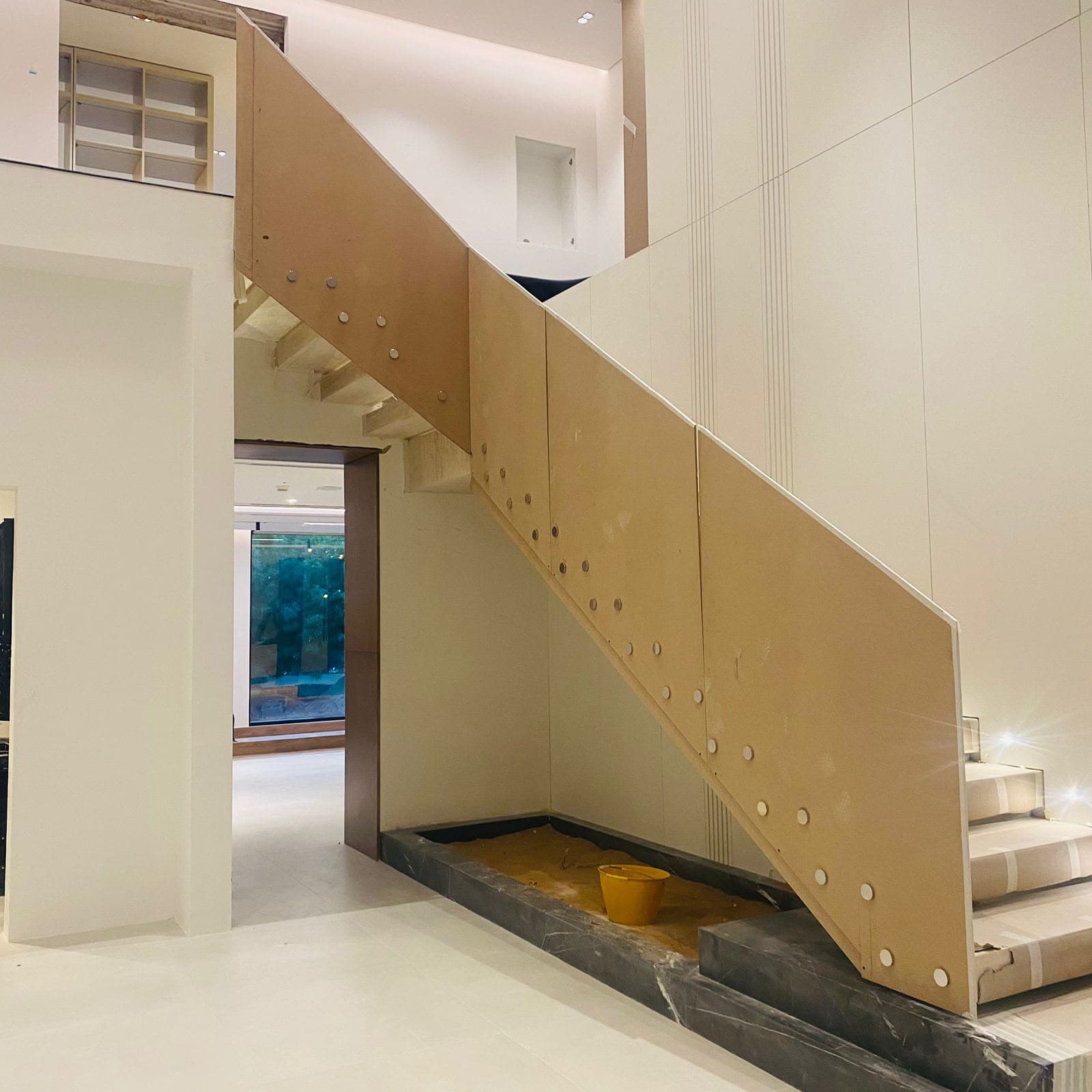 Staircase structure under construction with in-house fabricated frame