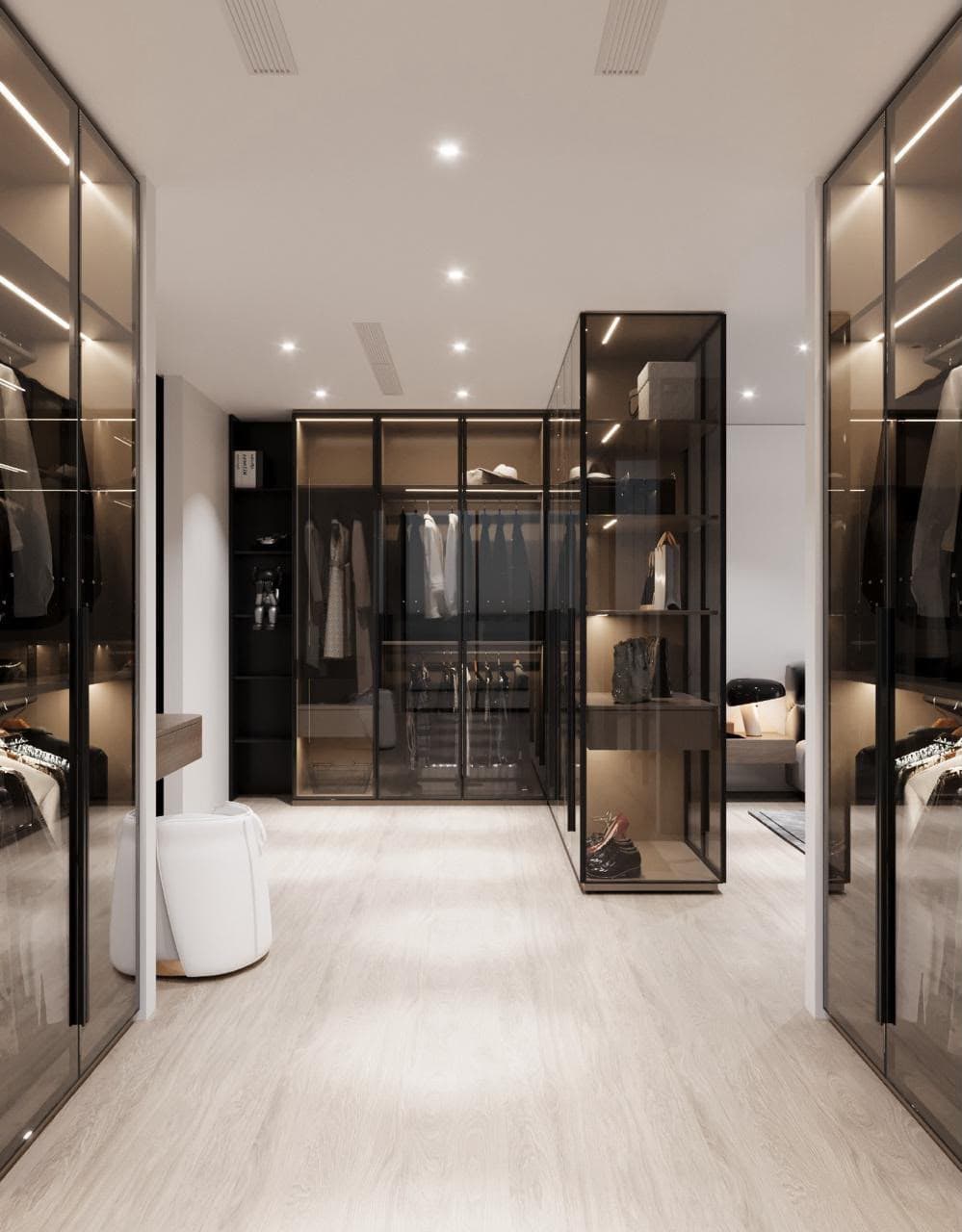 Frameless sliding glass wardrobe doors in a walk-in closet