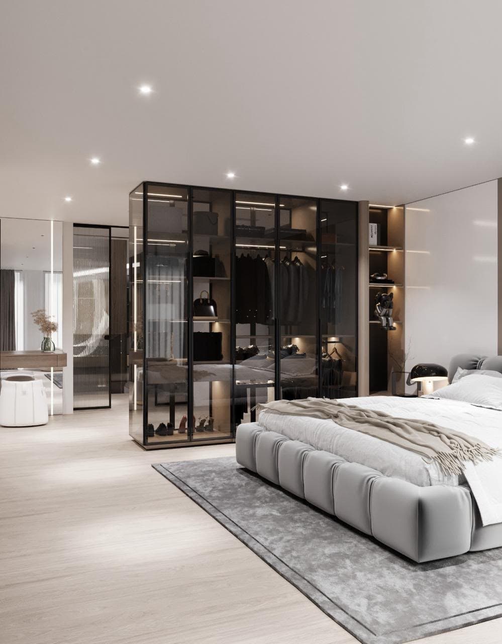 Bedroom with a frameless glass wardrobe partition